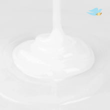 Baby Dove wash foam coming from dispenser pump, white lather in foreground