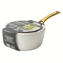 White ribbed saucepan with gold handle, shown with lid and outer carton