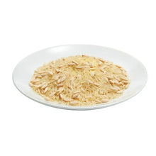 Plate of cooked rice pilaf with visible grains and light seasoning