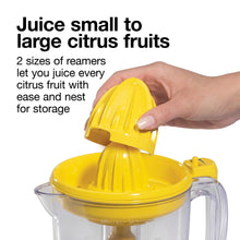 Electric citrus juicer reamer with yellow cover and clear pitcher for citrus fruit