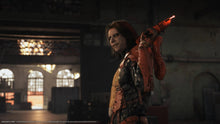 PS5 action game screenshot of a character aiming a red weapon indoors