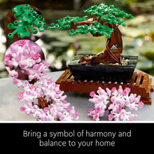 LEGO Icons bonsai tree model with green canopy, brown trunk, and pink blossom pieces