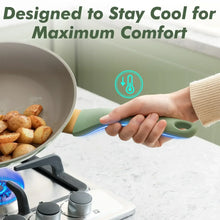 Green nonstick pot held by the handle over a glowing stovetop burner