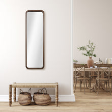 Walnut-framed slim wall mirror with rounded corners and vertical rectangular shape