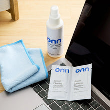 Screen cleaning kit bottle with blue cloths and towelettes cards near laptop