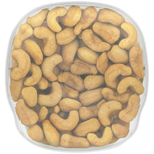 Round container filled with salted cashew halves and pieces