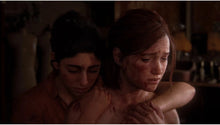 PlayStation 5 game screenshot: two injured women sitting close, bruised faces