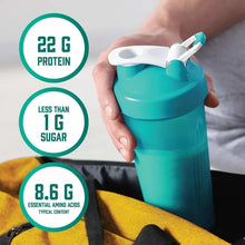 Teal protein shaker cup with white powder and scoop