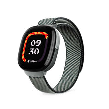 Kids LTE smartwatch with gray mesh strap, side view, screen shows 09 30 and 204 PTS