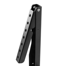 Black metal TV stand bracket leg with mounting holes and latch hardware.