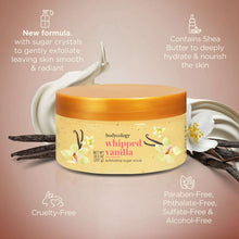 Whipped vanilla exfoliating sugar scrub jar with vanilla beans and orange lid.