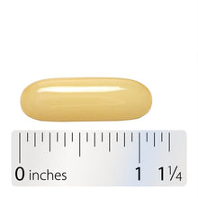 Coconut oil softgel capsule shown beside a 1 1/4 inch ruler