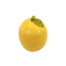 Yellow ceramic lemon candle lid with raised leaf detail