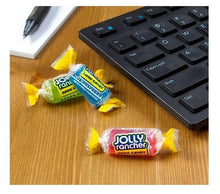 Individually wrapped JOLLY RANCHER hard candies on a tabletop