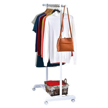 Rolling clothes rack with shirts on hangers and a handbag hook beside the top bar