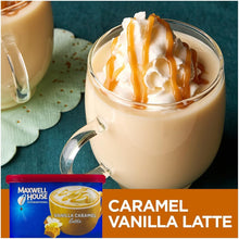Caramel vanilla latte in clear mug with whipped cream and caramel drizzle