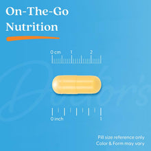 Yellow veggie capsule with pill size reference ruler