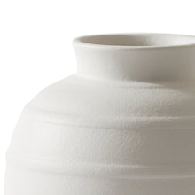 White ceramic vase with textured ribbed bands and flared rim