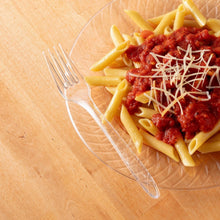 Clear plastic fork on pasta and sauce with grated cheese