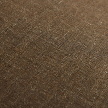 Close-up of brown linen fabric texture with fine speckled weave