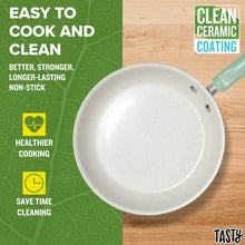 Sage green frying pan with white non-stick cooking surface