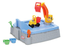 Digger sandbox playset with blue top, gray brick-style sides, yellow-red excavator