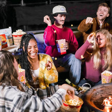 Microwave popcorn snack with people holding bowls of cheddar-flavored popcorn