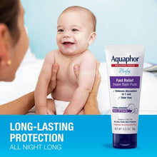 Aquaphor Baby Fast Relief diaper rash paste tube beside a baby during care