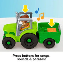 Green tractor toy with boy figure in cab, open bed, and musical-style details
