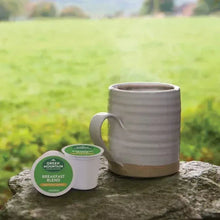 Green Mountain Breakfast Blend K-Cup pod and gray mug on stone