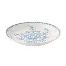 Blue stoneware appetizer plate with blue bouquet floral design and scalloped rim
