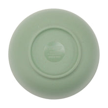 Bottom view of green bamboo melamine bowl with stamped label