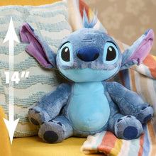 14 in blue plush alien with purple ears and antenna tuft, lying with arms out.