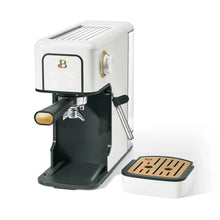 White espresso machine with black drip tray, gold control knob, and steam wand