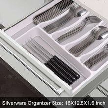 Stainless steel flatware neatly arranged in a silverware organizer tray