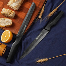 Chef knife and paring knife with speckled black blades and dark handles