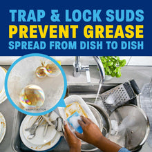 Dish soap suds in sink with plate and hand scrubbing