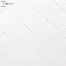 White quilted fabric surface with diamond stitching detail