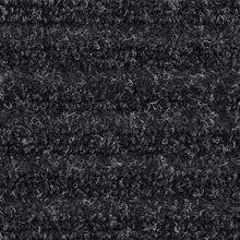 Charcoal tri-rib doormat surface with dense loop pile and fine speckled texture.