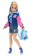 Disney Ily fashion doll wearing a blue hoodie, denim shorts, and pink-and-blue sneakers.