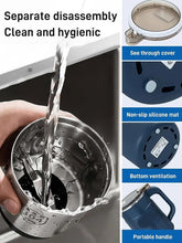 Blue electric grinder with open stainless chamber showing pouring flow and cover design