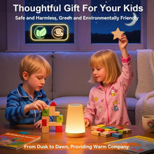 Kids playing with a warm-glow bedside night light on a living room table.