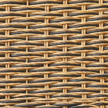 Woven resin rattan pattern on a rectangular serving tray, beige and dark strands