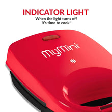 Red sandwich maker grill with indicator light on the top panel