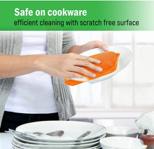 Orange microfiber sponge in hand, placed on a white dish for safe cleaning