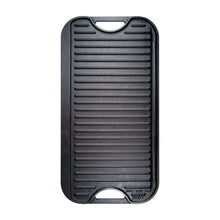 Reversible cast iron grill/griddle with ridged cooking surface and handle cutouts