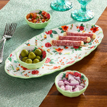 Ceramic serving tray with floral pattern and dip bowls in pale green for appetizers