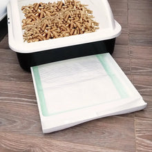 Cat litter box pad refill placed under litter tray liner, with tray on top