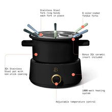 Black electric fondue pot with stainless lid, six forks, and adjustable temperature control