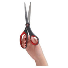 Hand holding bent scissors with red finger loops and dark gray blades